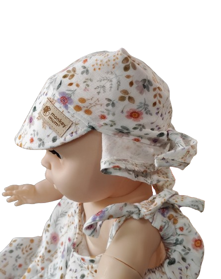 Fascia in mussola con visiera Monkey Mum® - Prato in fiore